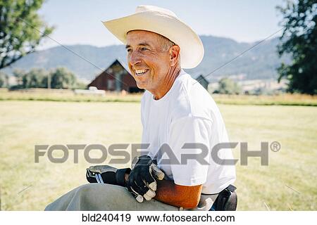 Portrait of smiling Caucasian farmer View Large Photo Image Stock Photo - Portrait of smiling Caucasian farmer. Fotosearch