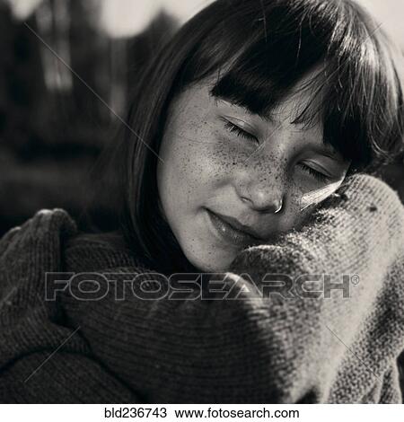 Portrait of smiling Caucasian girl wearing sweater View Large Photo Image Stock Image - Portrait of smiling Caucasian girl wearing sweater. Fotosearch