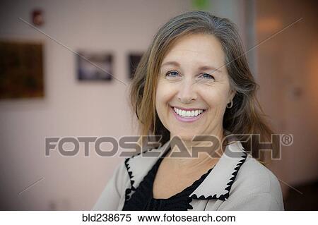 Stock Photography - Portrait of smiling Caucasian businesswoman. Fotosearch