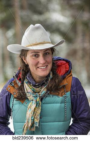 Stock Photograph - Portrait of smiling Caucasian woman in winter. Fotosearch