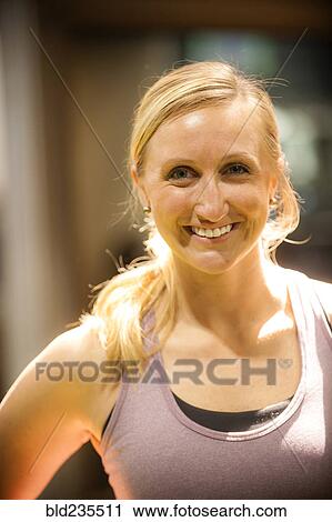 Stock Image - Portrait of smiling Caucasian woman. Fotosearch