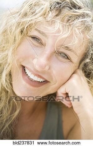 Stock Image - Portrait of smiling Caucasian woman. Fotosearch