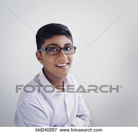 Stock Photo - Portrait of smiling Fiji Indian boy wearing eyeglasses. Fotosearch