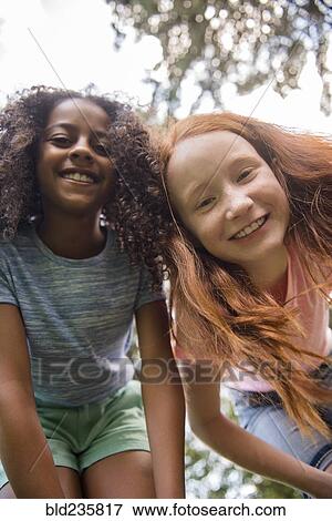Portrait of smiling girls View Large Photo Image Stock Photo - Portrait of smiling girls. Fotosearch