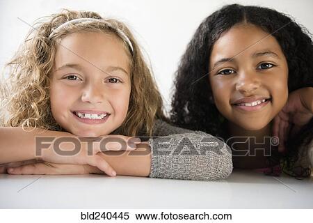 Stock Photography - Portrait of smiling girls. Fotosearch