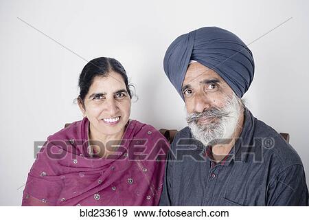 Stock Photo - Portrait of smiling Indian couple. Fotosearch