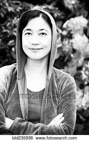 Stock Photograph - Portrait of smiling Japanese woman. Fotosearch