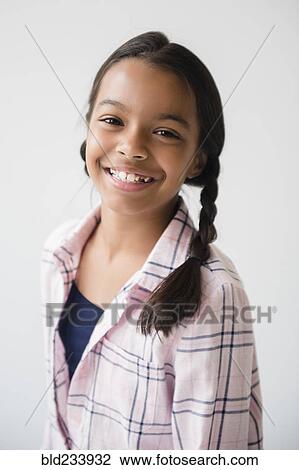 Stock Image - Portrait of smiling Mixed Race girl . Fotosearch