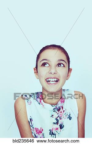 Portrait of smiling Mixed Race girl with big eyes View Large Photo Image Stock Photograph - Portrait of smiling Mixed Race girl with big eyes. Fotosearch