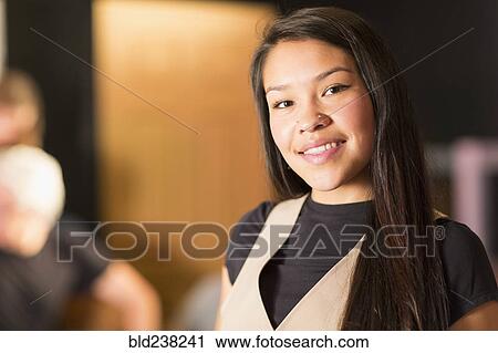 Stock Image - Portrait of smiling Mixed Race teenage girl. Fotosearch