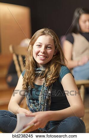 Portrait of smiling Mixed Race teenage girl in theater class View Large Photo Image Stock Photography - Portrait of smiling Mixed Race teenage girl in theater class. Fotosearch