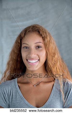 Portrait of smiling Mixed Race woman View Large Photo Image Stock Image - Portrait of smiling Mixed Race woman. Fotosearch