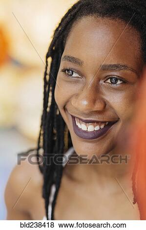 Stock Photo - Portrait of smiling Mixed Race woman. Fotosearch