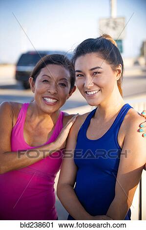 Portrait of smiling mother and daughter View Large Photo Image Stock Image - Portrait of smiling mother and daughter. Fotosearch