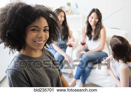 Portrait of smiling woman at party View Large Photo Image Stock Image - Portrait of smiling woman at party. Fotosearch
