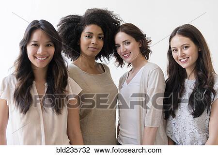 Stock Image - Portrait of smiling women. Fotosearch