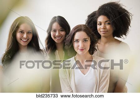 Stock Image - Portrait of smiling women. Fotosearch