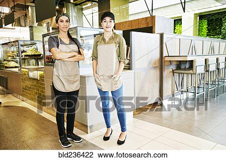 Portrait of smiling workers in food court View Large Photo Image Stock Image - Portrait of smiling workers in food court. Fotosearch
