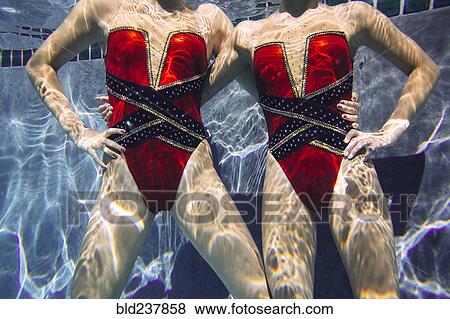 Portrait of synchronized swimmers underwater View Large Photo Image Stock Photo - Portrait of synchronized swimmers underwater. Fotosearch