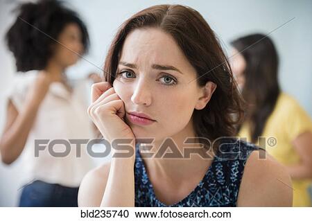 Stock Image - Portrait of unhappy woman. Fotosearch