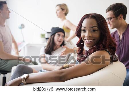 Portrait of woman smiling at party View Large Photo Image Stock Image - Portrait of woman smiling at party. Fotosearch