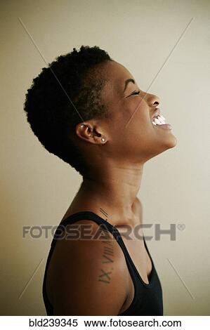 Profile of Black woman laughing View Large Photo Image Stock Photography - Profile of Black woman laughing. Fotosearch