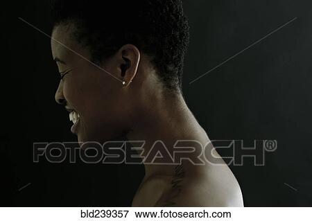 Stock Photo - Profile of Black woman laughing with eyes closed. Fotosearch