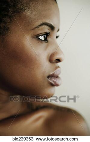 Stock Image - Profile of serious Black woman. Fotosearch