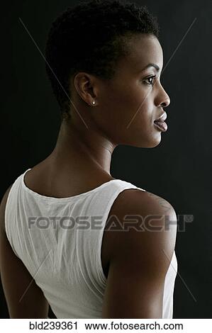 Stock Image - Profile of serious Black woman. Fotosearch
