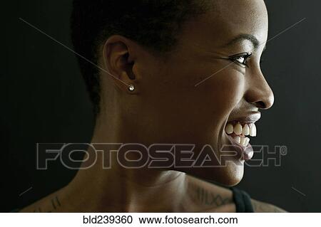 Profile of smiling Black woman View Large Photo Image Stock Image - Profile of smiling Black woman. Fotosearch