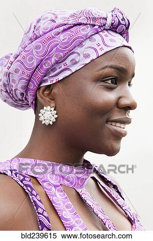 Stock Photography - Profile of smiling Black woman. Fotosearch