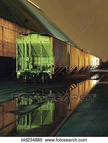 Puddles near trains View Large Photo Image Stock Photography - Puddles near trains. Fotosearch