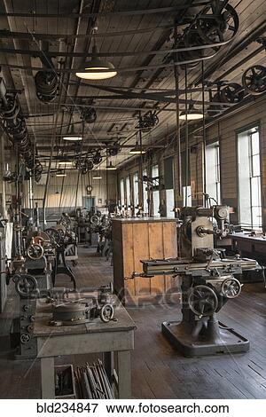 Pulleys and machinery in empty old-fashioned factory View Large Photo Image Stock Photo - Pulleys and machinery in empty old-fashioned factory. Fotosearch