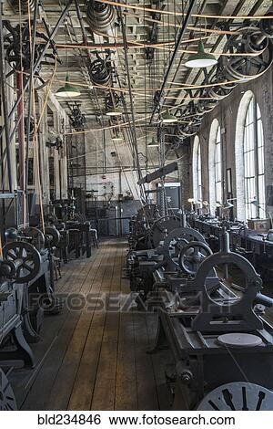 Pulleys and machinery in empty old-fashioned factory View Large Photo Image Stock Photograph - Pulleys and machinery in empty old-fashioned factory. Fotosearch
