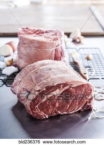Raw beef rib roast wrapped with string View Large Photo Image Stock Photograph - Raw beef rib roast wrapped with string. Fotosearch