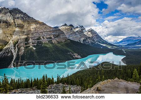 Reflection of clouds in still mountain lake View Large Photo Image Stock Image - Reflection of clouds in still mountain lake. Fotosearch