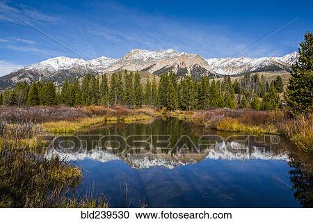 Reflection of mountain in river View Large Photo Image Stock Image - Reflection of mountain in river. Fotosearch