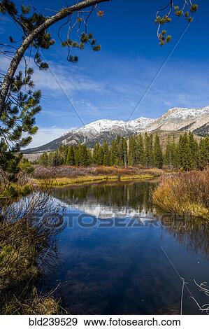 Reflection of mountain in river View Large Photo Image Stock Photo - Reflection of mountain in river. Fotosearch
