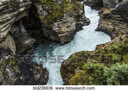 River rapids winding through rocks View Large Photo Image Stock Photograph - River rapids winding through rocks. Fotosearch