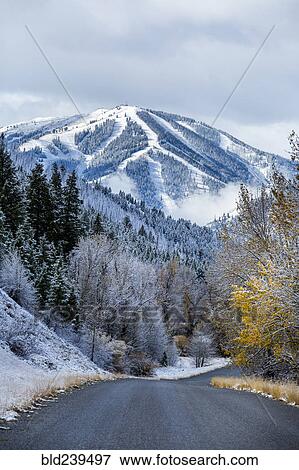 Stock Photo - Road to snowy mountain. Fotosearch