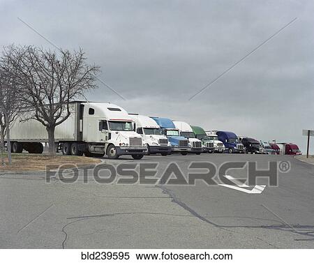 Stock Photography - Row of parked semi-trucks. Fotosearch