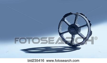 Rusty wheel casting shadow View Large Photo Image Stock Photograph - Rusty wheel casting shadow. Fotosearch