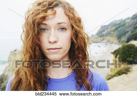 Stock Photography - Serious Caucasian woman at beach. Fotosearch