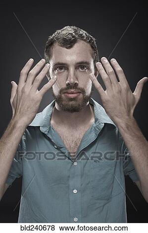 Stock Photo - Serious man showing hands. Fotosearch
