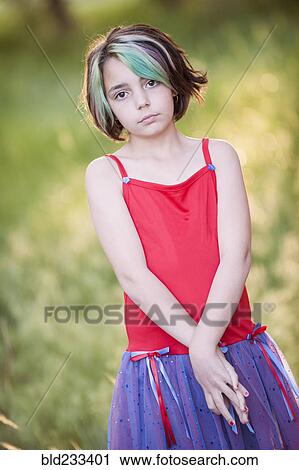 Serious Mixed Race girl with multicolor hair View Large Photo Image Stock Image - Serious Mixed Race girl with multicolor hair. Fotosearch
