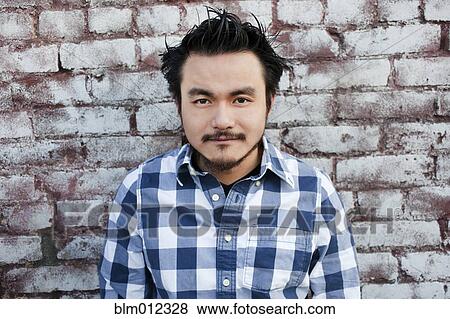 Serious mixed race man View Large Photo Image Stock Photo - Serious mixed race man. Fotosearch