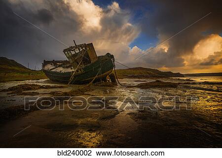 Shipwreck on beach at sunset View Large Photo Image Stock Image - Shipwreck on beach at sunset. Fotosearch