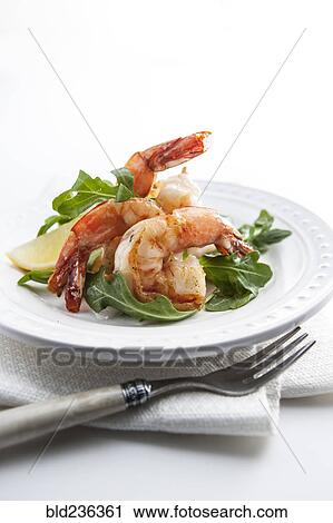 Stock Image - Shrimp on plate with fork. Fotosearch