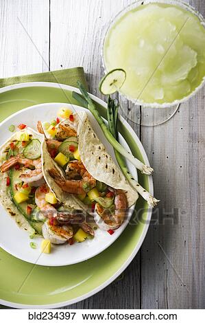 Shrimp tacos and frozen margarita View Large Photo Image Stock Photo - Shrimp tacos and frozen margarita. Fotosearch