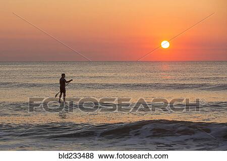 Silhouette of man on ocean View Large Photo Image Stock Photo - Silhouette of man on ocean. Fotosearch